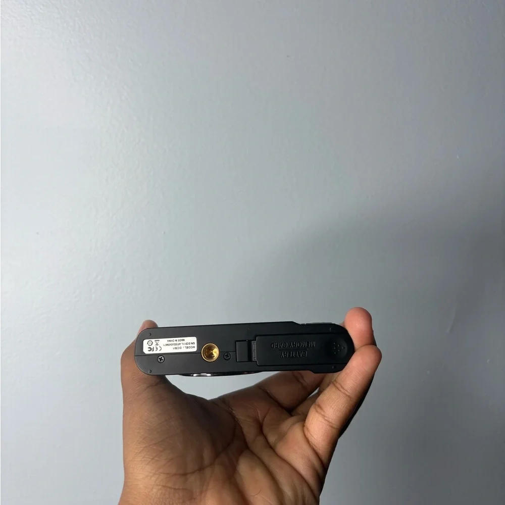 Compact Black Camera with Silver Accents